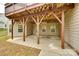 Covered outdoor patio area perfect for entertaining or relaxing with overhead deck and exposed rafter design at 373 Fischer Rd, Fort Mill, SC 29715