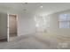 Spacious bedroom with carpet flooring and ample closet space at 5117 Tinker Field Rd, Charlotte, NC 28215