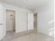 Spacious bedroom with closet and neutral decor at 5117 Tinker Field Rd, Charlotte, NC 28215