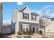 Two-story house with gray and beige siding, a two-car garage, and a landscaped lawn at 5117 Tinker Field Rd, Charlotte, NC 28215