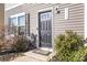 Modern dark-gray front door with a glass panel and sidelights at 5117 Tinker Field Rd, Charlotte, NC 28215