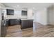 Modern kitchen with dark cabinetry and stainless steel appliances at 5117 Tinker Field Rd, Charlotte, NC 28215