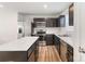 Modern kitchen with stainless steel appliances and an island at 5117 Tinker Field Rd, Charlotte, NC 28215