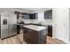 Updated kitchen with stainless steel appliances and island at 5117 Tinker Field Rd, Charlotte, NC 28215