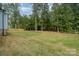 Large backyard with trees surrounding the property at 562 Shepherd Ln # 3, Clover, SC 29710