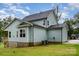 View of backyard featuring grass lawn, back exterior of house with porch and window details at 562 Shepherd Ln # 3, Clover, SC 29710