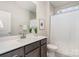 Bathroom featuring single vanity with gray cabinets, white countertop, and tile surround shower/tub combination at 562 Shepherd Ln # 3, Clover, SC 29710