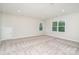 Spacious bedroom featuring neutral carpet and paint, natural light, and a standard closet at 562 Shepherd Ln # 3, Clover, SC 29710