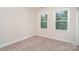 Cozy bedroom with neutral carpet and paint, natural light, and standard base molding at 562 Shepherd Ln # 3, Clover, SC 29710