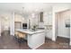 Well-lit kitchen with a marble island and a view into the dining room at 562 Shepherd Ln # 3, Clover, SC 29710