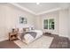 Comfortable main bedroom featuring a tray ceiling, plush rug, and seating area at 562 Shepherd Ln # 3, Clover, SC 29710