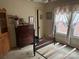 Bedroom with hardwood floors and antique furniture at 614 Morven Rd, Wadesboro, NC 28170