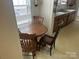 Small round wooden table with four chairs in a quaint dining area at 614 Morven Rd, Wadesboro, NC 28170