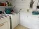 View of a laundry room with washer, dryer, and storage at 614 Morven Rd, Wadesboro, NC 28170