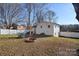 View of the home's backyard, including a trampoline and grill at 816 Wellwood Ave, Statesville, NC 28677