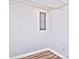 A bright, clean basement corner with white walls, wood floors, and electrical panel at 816 Wellwood Ave, Statesville, NC 28677