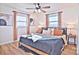 Cozy bedroom with a king-size bed and a ceiling fan at 816 Wellwood Ave, Statesville, NC 28677