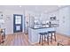 Modern kitchen with white cabinets and a large island at 816 Wellwood Ave, Statesville, NC 28677