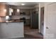 Modern kitchen with granite countertops and stainless steel appliances at 9618 Langston Mill Rd # 38, Charlotte, NC 28216