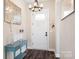 Elegant entryway with a console table and chandelier at 136 Chimney Rock Ct, Denver, NC 28037