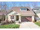 Craftsman style home with two-car garage and landscaped front yard at 136 Chimney Rock Ct, Denver, NC 28037