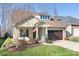 Attractive craftsman home with inviting front porch and landscaping at 136 Chimney Rock Ct, Denver, NC 28037