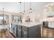 Large kitchen island with granite countertop and seating at 136 Chimney Rock Ct, Denver, NC 28037