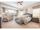 Spacious main bedroom with ample natural light and sitting area at 136 Chimney Rock Ct, Denver, NC 28037