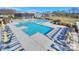 Resort-style pool area with multiple pools, lounge chairs, and umbrellas at 136 Chimney Rock Ct, Denver, NC 28037