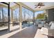 Relaxing screened porch with seating and patio view at 136 Chimney Rock Ct, Denver, NC 28037