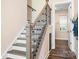 Stylish staircase with modern railing and wooden steps at 136 Chimney Rock Ct, Denver, NC 28037