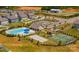 Aerial view of a community pool, tennis court, playground, and well-maintained landscaping at 3877 Lake Breeze Dr, Sherrills Ford, NC 28673