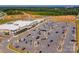 Aerial view of a commercial shopping center with ample parking and a variety of retail stores at 3877 Lake Breeze Dr, Sherrills Ford, NC 28673