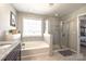 This bathroom has a soaking tub, tiled shower and granite vanity at 3877 Lake Breeze Dr, Sherrills Ford, NC 28673