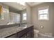 Bathroom featuring a granite vanity, a single sink and a mirror at 3877 Lake Breeze Dr, Sherrills Ford, NC 28673