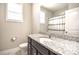 Bathroom featuring granite countertops, vanity with storage, a shower/tub combination, and natural light at 3877 Lake Breeze Dr, Sherrills Ford, NC 28673