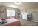 Charming bedroom featuring a comfortable pink bed, a window with natural light, and playful decor at 3877 Lake Breeze Dr, Sherrills Ford, NC 28673