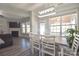 Dining area bathed in natural light provides seamless access to the living room and backyard patio at 3877 Lake Breeze Dr, Sherrills Ford, NC 28673