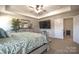 This main bedroom features a decorative ceiling fan, large television, and neutral walls at 3877 Lake Breeze Dr, Sherrills Ford, NC 28673