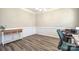 Office featuring chair rail molding, natural light, and wood-look floors for a professional workspace at 3877 Lake Breeze Dr, Sherrills Ford, NC 28673