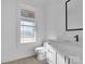 Clean bathroom featuring white vanity and updated toilet at 3907 E Lawyers Rd, Monroe, NC 28110