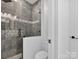 Modern bathroom with walk-in shower and gray tile at 3907 E Lawyers Rd, Monroe, NC 28110