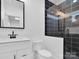 Modern bathroom with black and white tile and glass shower at 3907 E Lawyers Rd, Monroe, NC 28110