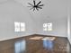 Spacious bedroom with hardwood floors and a ceiling fan at 3907 E Lawyers Rd, Monroe, NC 28110