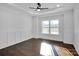 Bright bedroom with hardwood floors and white wainscoting at 3907 E Lawyers Rd, Monroe, NC 28110