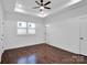 Spacious bedroom with hardwood floors and ceiling fan; access to bath at 3907 E Lawyers Rd, Monroe, NC 28110