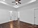 Well-lit bedroom with hardwood floors and private bathroom at 3907 E Lawyers Rd, Monroe, NC 28110