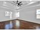 Large bedroom with hardwood floors and a ceiling fan at 3907 E Lawyers Rd, Monroe, NC 28110