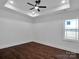 Bright bedroom featuring hardwood floors and a ceiling fan at 3907 E Lawyers Rd, Monroe, NC 28110