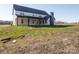 Two-story farmhouse showcasing rear elevation with covered porch at 3907 E Lawyers Rd, Monroe, NC 28110